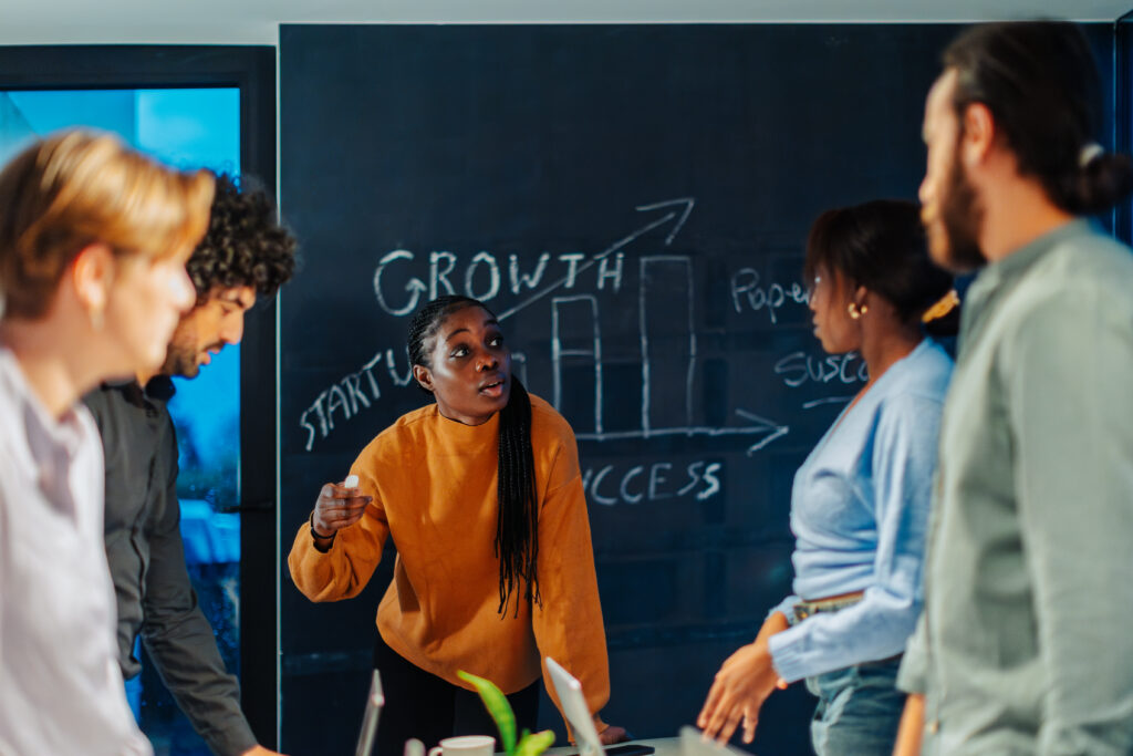 A team of customer acquisition strategists collaborating together