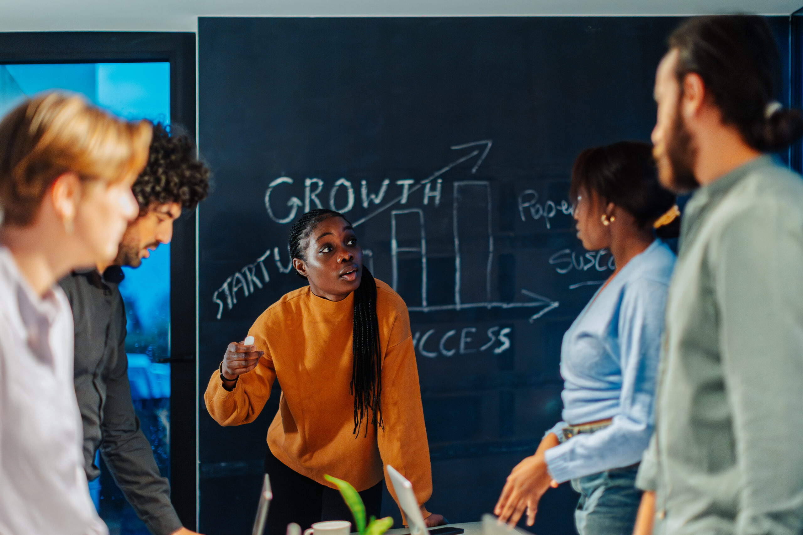 A team of customer acquisition strategists collaborating together