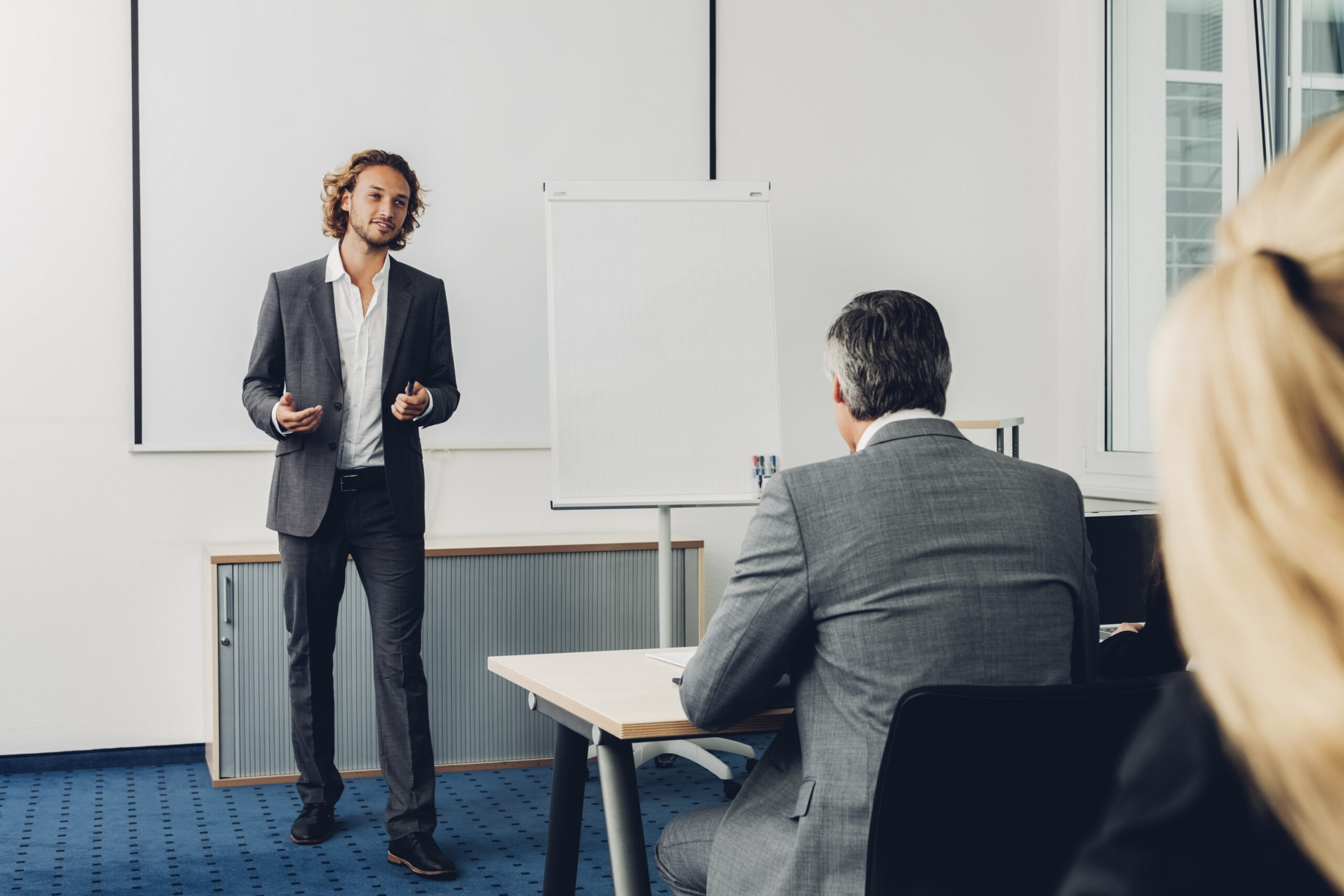 A young professional with the right sales mindset making a business pitch
